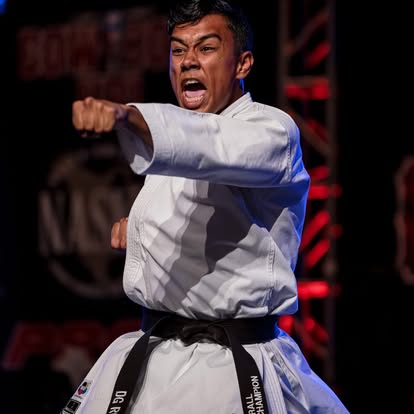 Adult black belt demonstrating martial arts performance